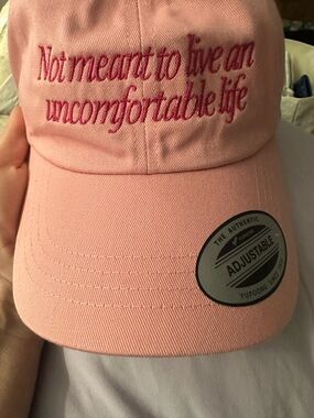 The White Lotus “not meant to live an uncomfortable life” Pink Hat